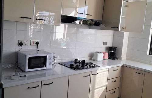Mbotela Apartamento | Enchanting 5-bedroom apartment with fitness room in Nairobi