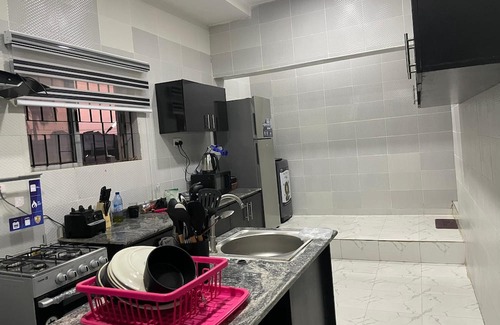 Abeokuta Casa | Newly renovated almost heaven 2 bdrm; large living room with view of courtyard.