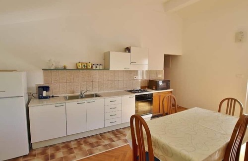 Supetarska Draga Apartamento | Three bedroom apartment with terrace and sea view Rab (A-24682-a)