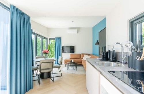 Scharendijke Casa | Welcome to Muralt 111, a modern chalet with everything for a carefree stay. Enjoy the cozy living ro