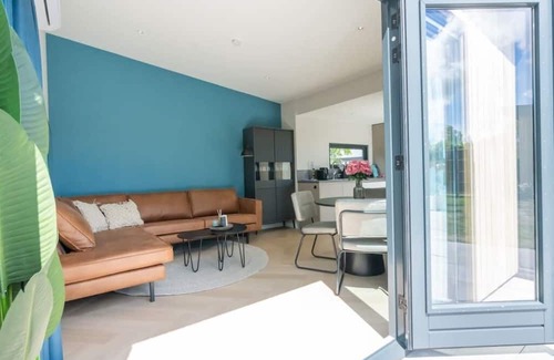 Scharendijke Casa | Welcome to Muralt 111, a modern chalet with everything for a carefree stay. Enjoy the cozy living ro