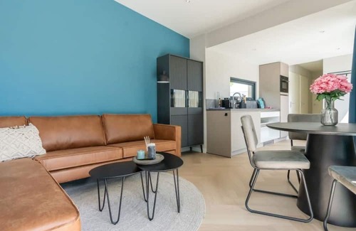 Scharendijke Casa | Welcome to Muralt 111, a modern chalet with everything for a carefree stay. Enjoy the cozy living ro