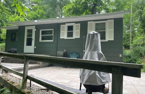 Monroe Cabina | European inspired 2-bedroom cabin with a brooke in back patio, in Monroe, NY.