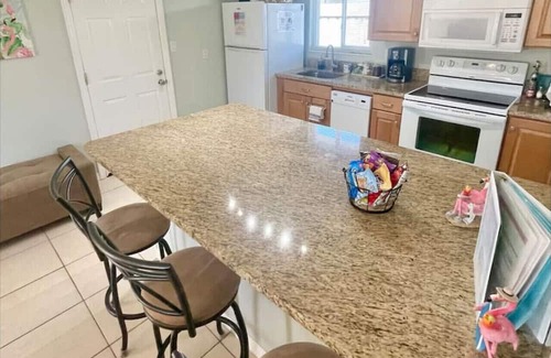 Cocoa Beach Casa | Fiesta Flamingo Cottage: Your Cocoa Beach Paradise with Kayaks & Bikes