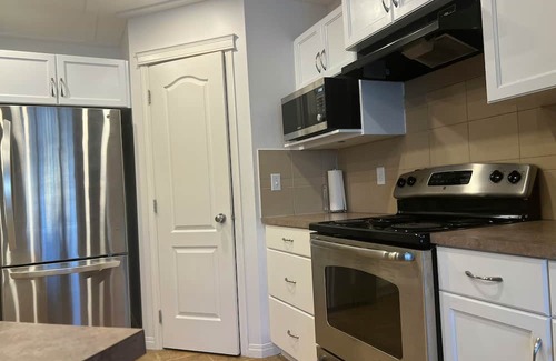 Airdrie Casa | Entire Living Room and Bedrooms
