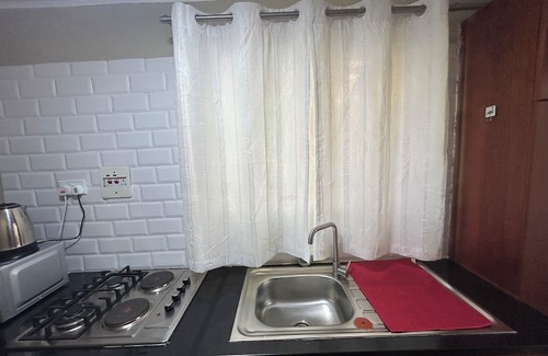 Lusaka Cabaña | Charming Mango Cottage in Lusaka – Garden Views & Free WiFi
