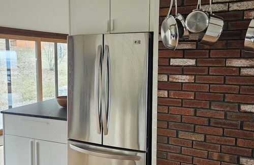 Cragsmoor Casa | A spectacular Shawangunk vista in a beautifully renovated chalet on a lush lawn.