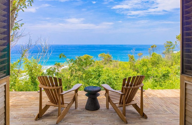 Spacious beachside home with pool, tropical garden, and oceanview lounging