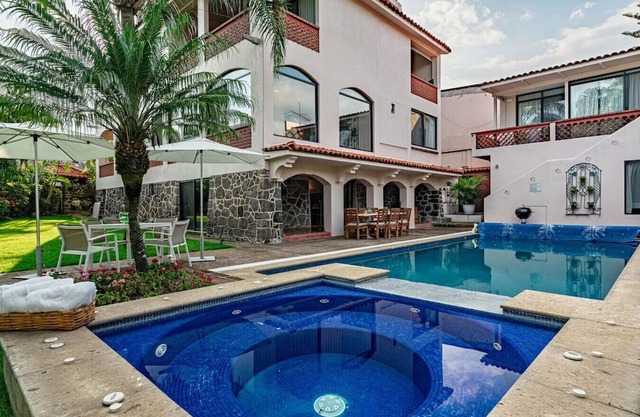 Colonial Getaway with Pool, Hot Tub, and Lush Garden for Relaxation
