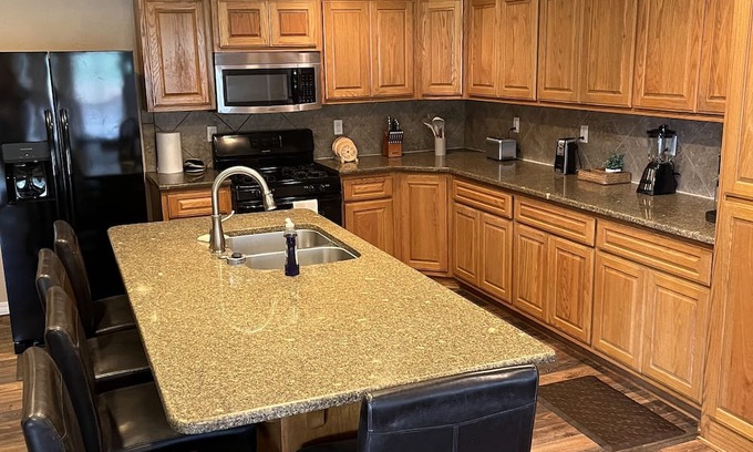Board Camp Casa | Ride to the ATV trails from this Spacious 4-bedroom house with RV hookup!