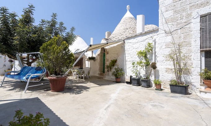 Casalini Casa | Casa de vacaciones 'Trullo Antica Pietra' con terraza privada, jardín privado y aire acondicionado