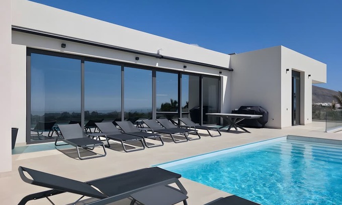 El Madronal Villa | Holiday Villa 'Karat Caldera' with Sea View, Wi-Fi and Air Conditioning